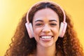 Music, portrait and smile with a black woman listening to the radio outdoor on a yellow wall background. Headphones Royalty Free Stock Photo