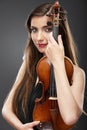 Music portrait of young woman. Violin play.