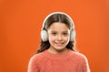 Music produces pleasure. Perfect sound stereo headphones. Girl cute little child wear headphones listen music. Kid