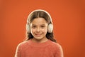 Music produces pleasure. Perfect sound stereo headphones. Girl cute little child wear headphones listen music. Kid