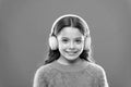 Music produces pleasure. Perfect sound stereo headphones. Girl cute little child wear headphones listen music. Kid