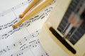 Music score, drum sticks and metronome Royalty Free Stock Photo
