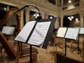 Music score with notes in hall of the conservatory at classical music concert Royalty Free Stock Photo