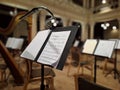 Music score with notes in hall of the conservatory at classical music concert Royalty Free Stock Photo