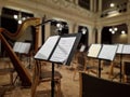 Music score with notes in hall of the conservatory at classical music concert Royalty Free Stock Photo