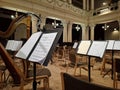 Music score with notes in hall of the conservatory at classical music concert Royalty Free Stock Photo