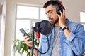 music, show business, people and voice concept.confident male singer with headphones Royalty Free Stock Photo