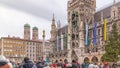 Music show on Clock Tower or Glockenspiel close-up, Detail of Rathaus New Town Hall with chime in city center timelapse Royalty Free Stock Photo