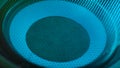 Subwoofer with membrane neon blue light moving vibrating, macro sound bass circles, abstract background.