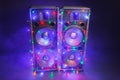 Music speakers with festive Christmas lights and smoke Royalty Free Stock Photo