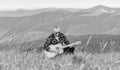 music speaks. sexy man with guitar in checkered shirt. hipster fashion. western camping and hiking. happy and free Royalty Free Stock Photo