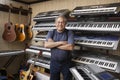 Music Store Owner Standing Arms Crossed