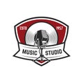 Music studio. Emblem template with retro microphone. Design element for logo, label, emblem, sign.
