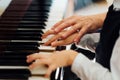 Music teacher helps student to play correctly Royalty Free Stock Photo