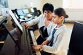 Music teacher with the pupil at lesson piano