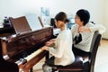 Music teacher with the pupil at lesson piano Royalty Free Stock Photo