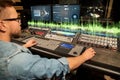Man at mixing console in music recording studio Royalty Free Stock Photo