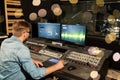 Man at mixing console in music recording studio