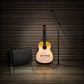 Music themed background with acoustic guitar , amp and microphone. Royalty Free Stock Photo