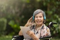 Music therapy in dementia treatment on elderly woman Royalty Free Stock Photo