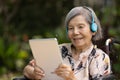 Music therapy in dementia treatment on elderly woman Royalty Free Stock Photo