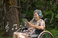 Music therapy in dementia treatment on elderly woman Royalty Free Stock Photo