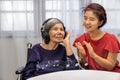 Music therapy in dementia treatment on elderly woman Royalty Free Stock Photo