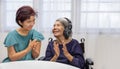 Music therapy in dementia treatment on elderly woman Royalty Free Stock Photo