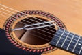 Music tuning fork on acoustic guitar strings Royalty Free Stock Photo