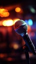 Musical ambiance microphones close up silhouette amid out of focus stage lights