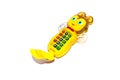 Musical baby toy phone on a white background . The toy runs on batteries Royalty Free Stock Photo