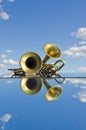 Musical brass wind instruments on mirror