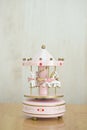 Musical carousel. A pink merry-go-round music box with pink.