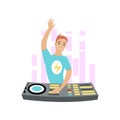 Young DJ with hand up mixing music on turntables isolated on white background.