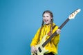 Musical Concepts. One Winsome Caucasian Female Guitar Player With White Bass Guitar Holding Instrument Nearby With Playful Royalty Free Stock Photo