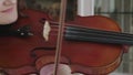 Musical craft by exultant female violinist at camera