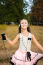 Musical girl dancing with headphones