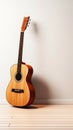 Musical harmony: Acoustic guitar and keys laid flat on a pristine white backdrop.