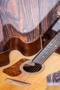 Close up of acoustic guitar. Acoustic guitar against an old wooden background Royalty Free Stock Photo