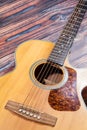 Close up of acoustic guitar. Acoustic guitar against an old wooden background Royalty Free Stock Photo