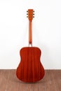 Musical instrument - back view acoustic guitar wood and white background Royalty Free Stock Photo