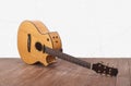 Musical instrument - Broken acoustic guitar white wall Royalty Free Stock Photo