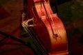 musical instrument double bass with a bow lies on the stage