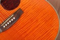 Musical instrument - Fragment orange acoustic guitar Royalty Free Stock Photo