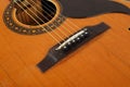 Musical instrument - Top view pickguard, bridge, pins and strings retro acoustic guitar Royalty Free Stock Photo