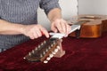 Guitar repair and service - Worker to sharpen the special tool g Royalty Free Stock Photo