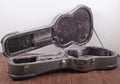 Musical instrument - Open silver acoustic guitar hard case