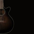 Musical instrument - Silhouette of a brown acoustic guitar isolated on black Royalty Free Stock Photo