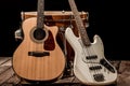 musical instruments, bass drum barrel acoustic guitar and bass guitar on a black background