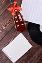 Musical instruments and blank paper notebook. Royalty Free Stock Photo